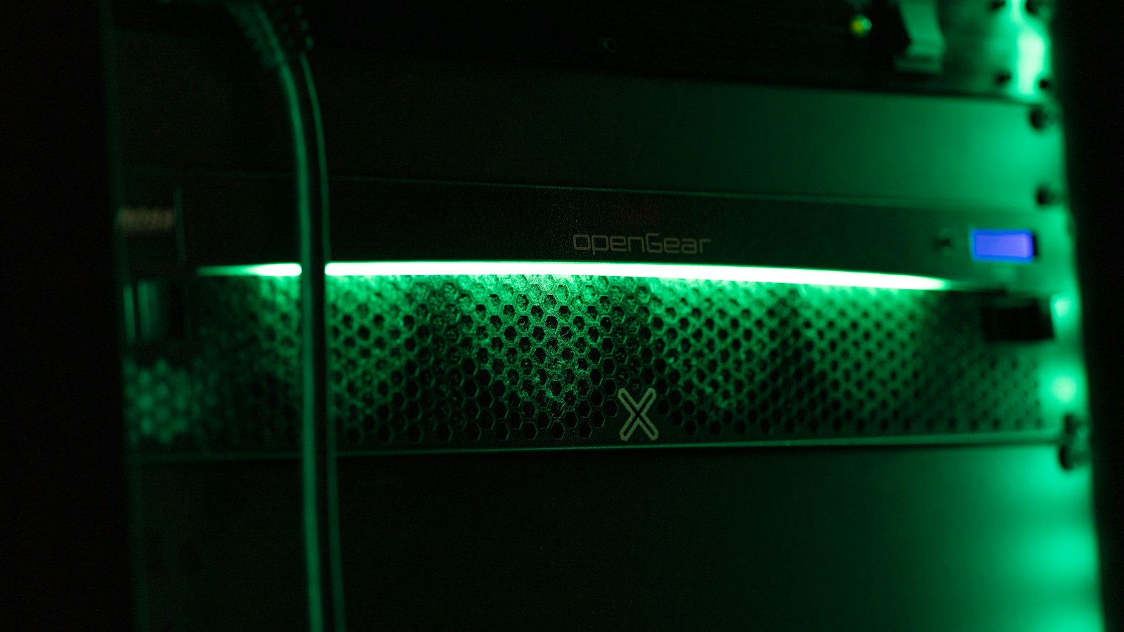 a close up of a green light in a server