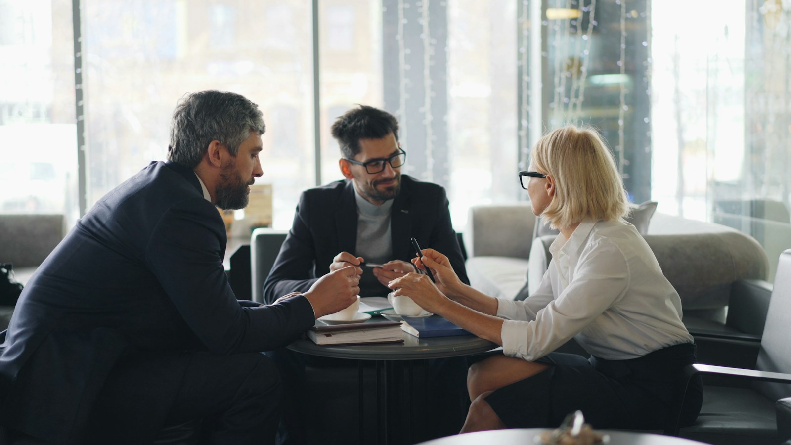 a group of people sitting around a table