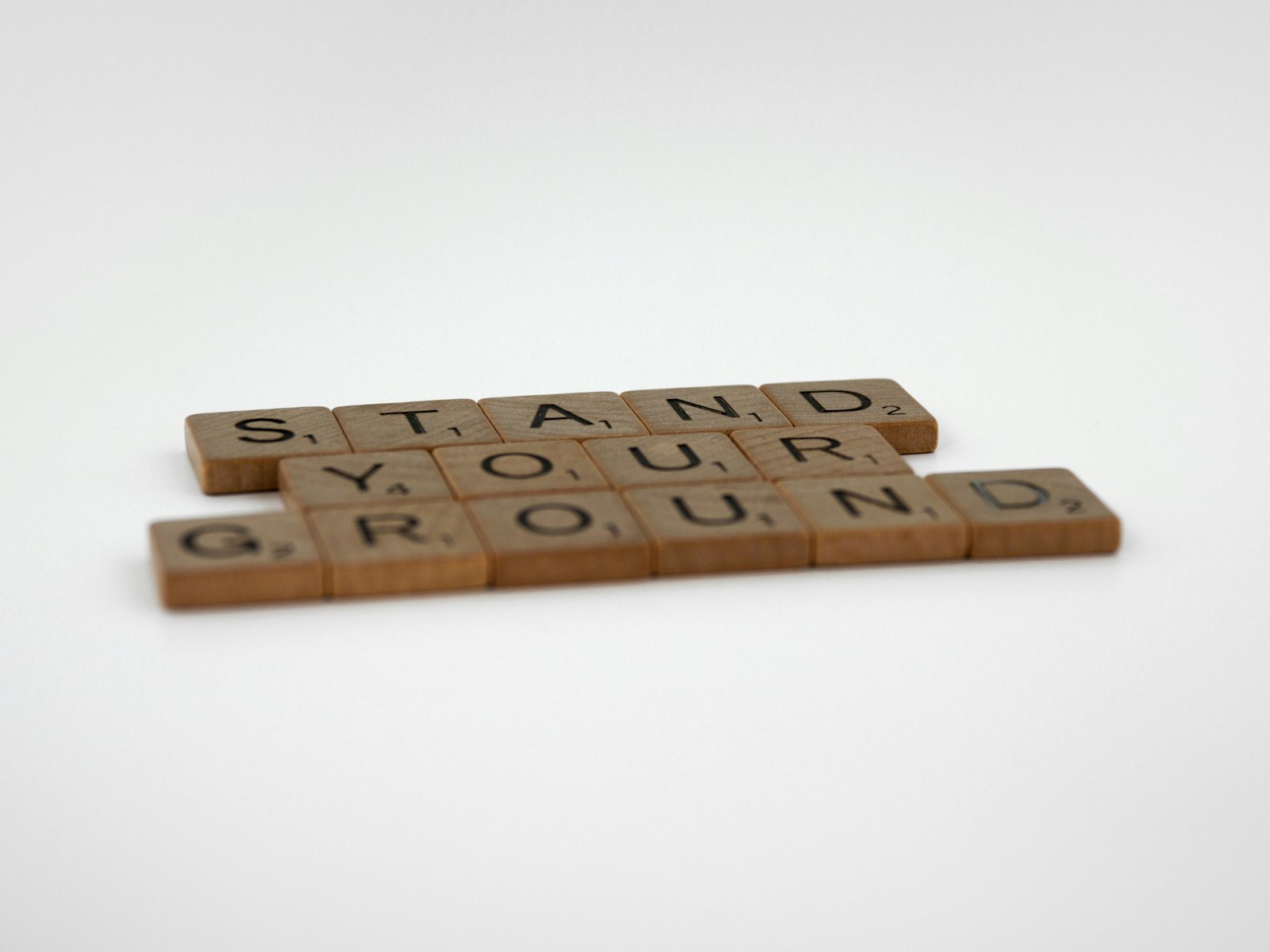 a couple of scrabble tiles sitting on top of a table
