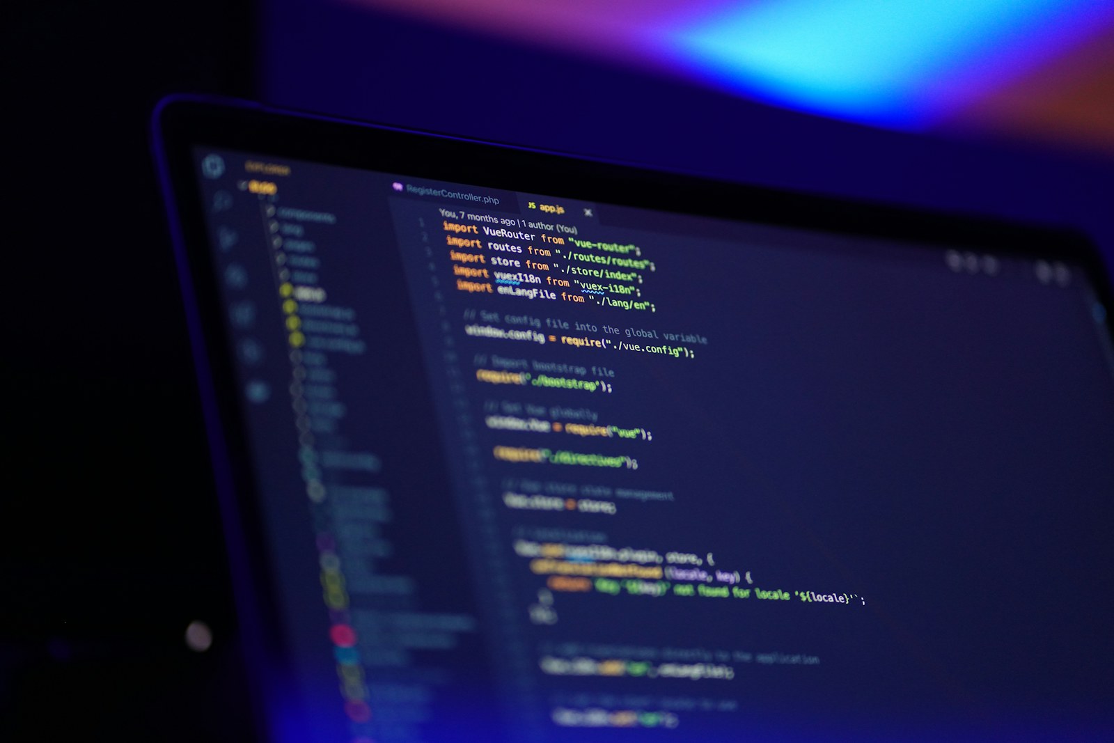 laptop screen displaying colorful code