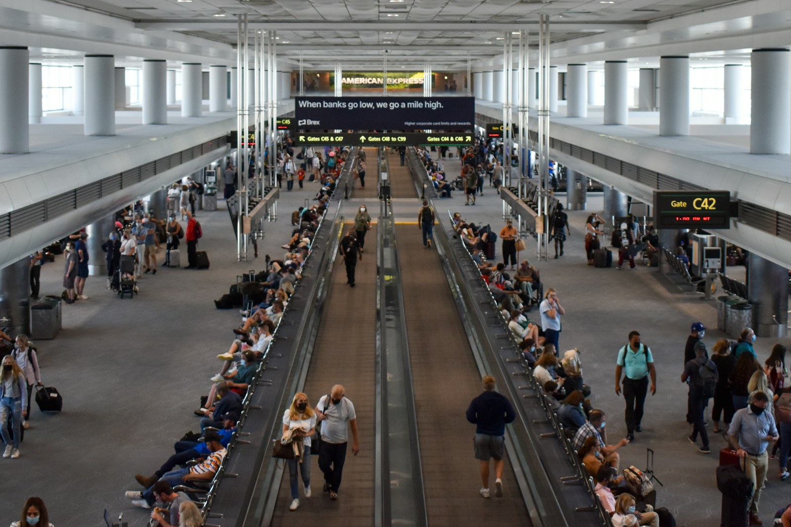 A group of people walking through an airport