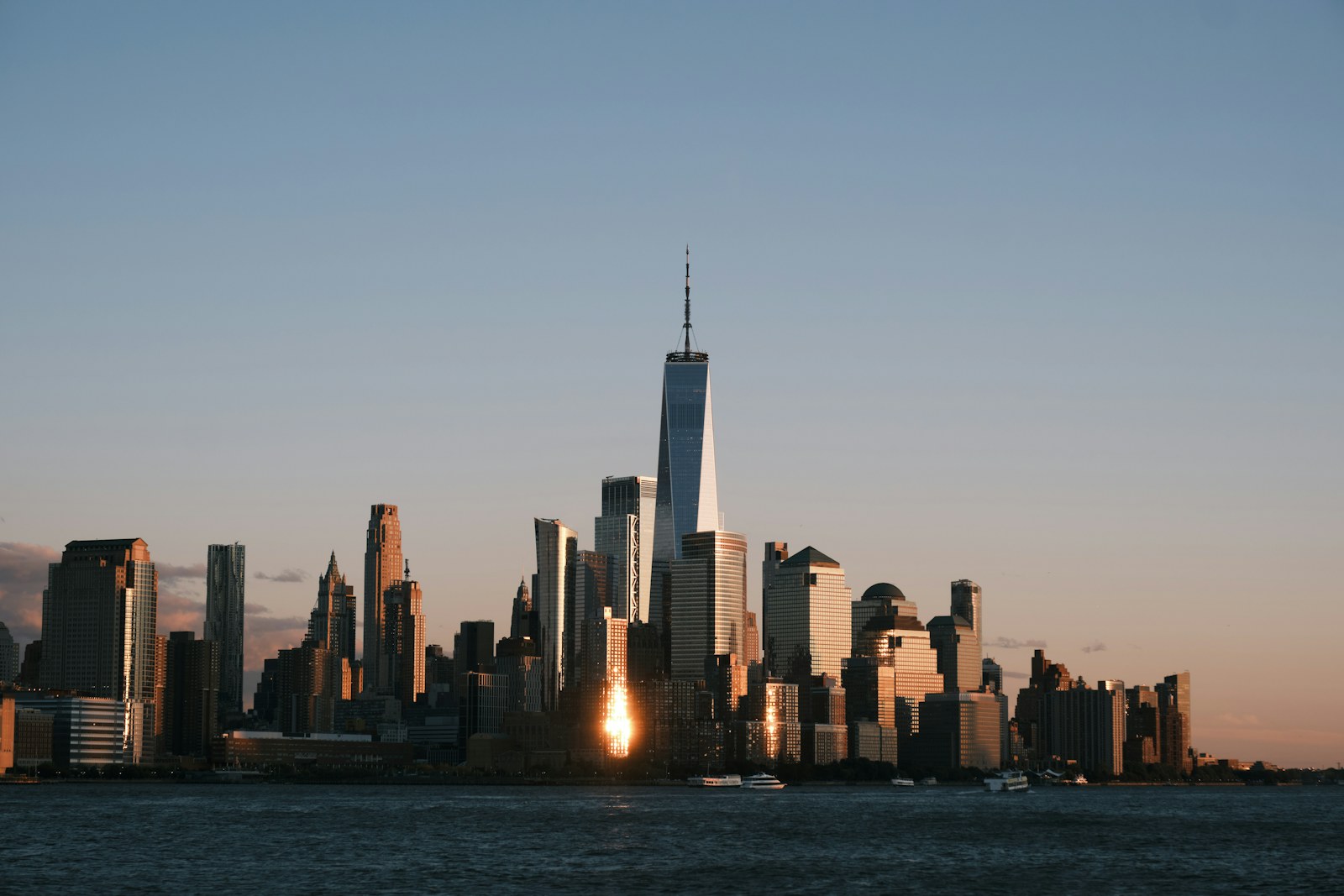 Downtown manhattan skyline at sunset from across the water