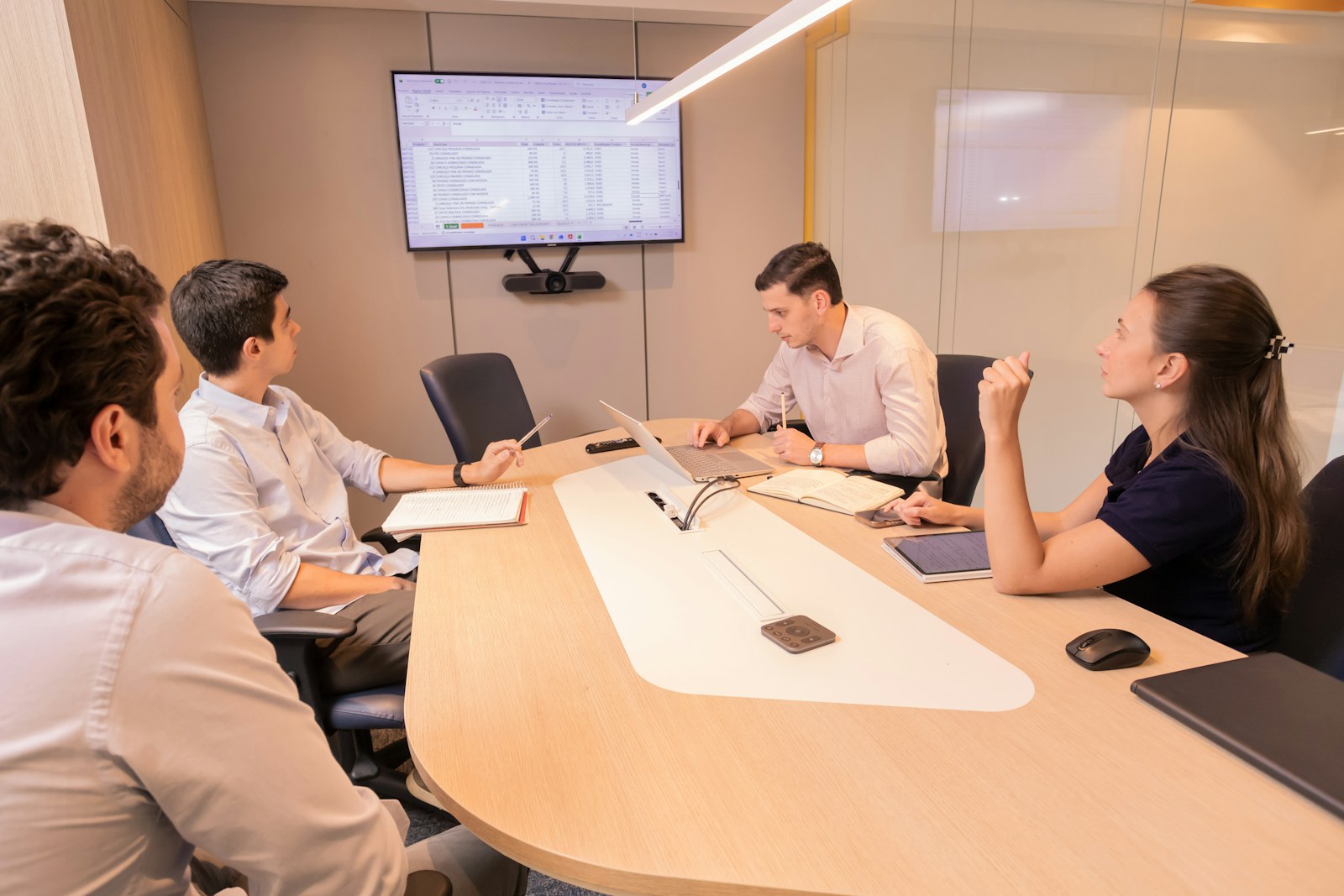 Business meeting with people around a conference table