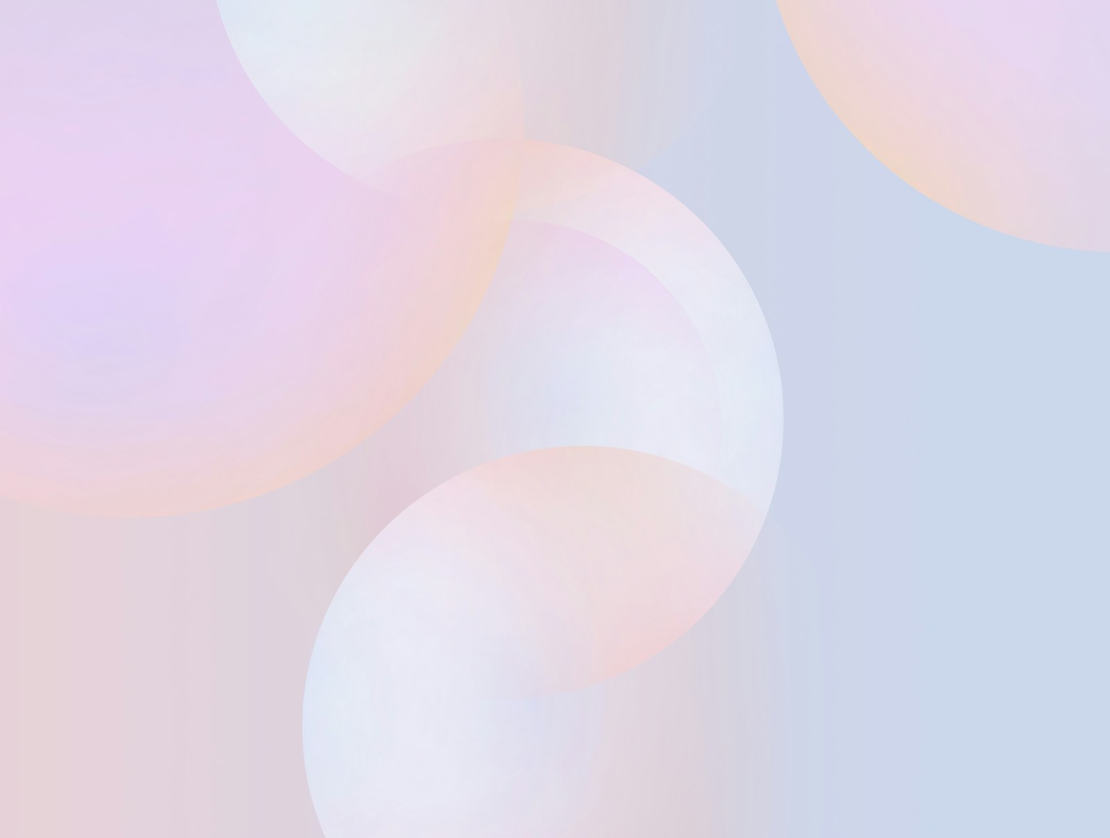Overlapping translucent circles in soft shades of pink and light blue