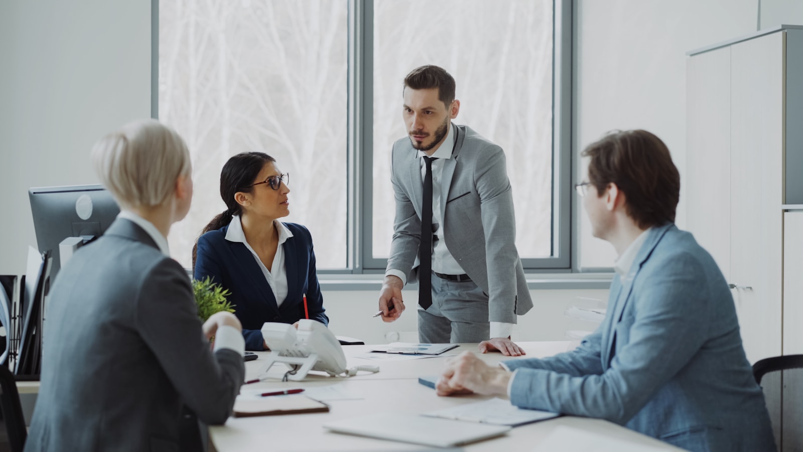 Business professionals in a meeting around a table