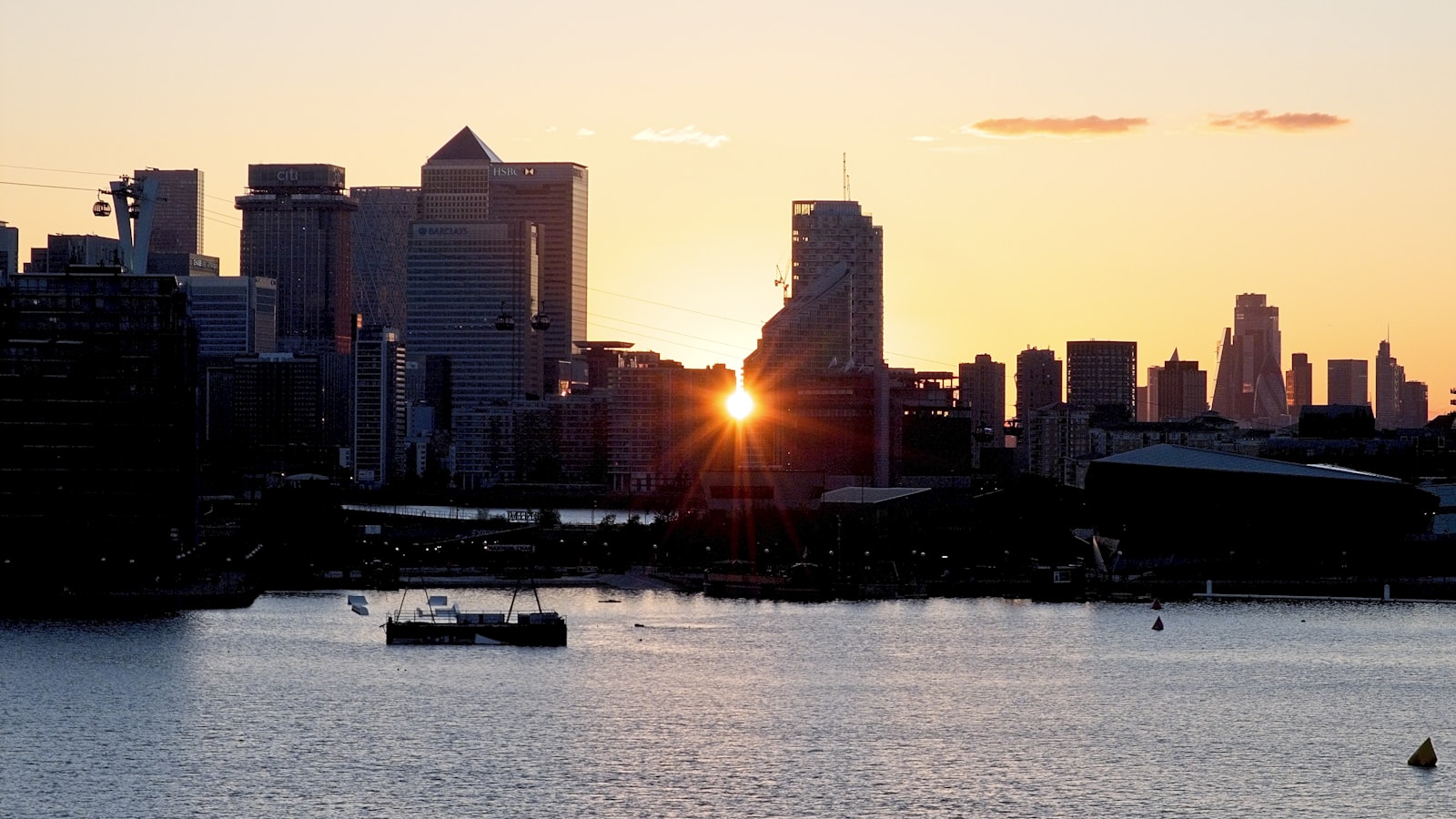 City skyline at sunrise over the water