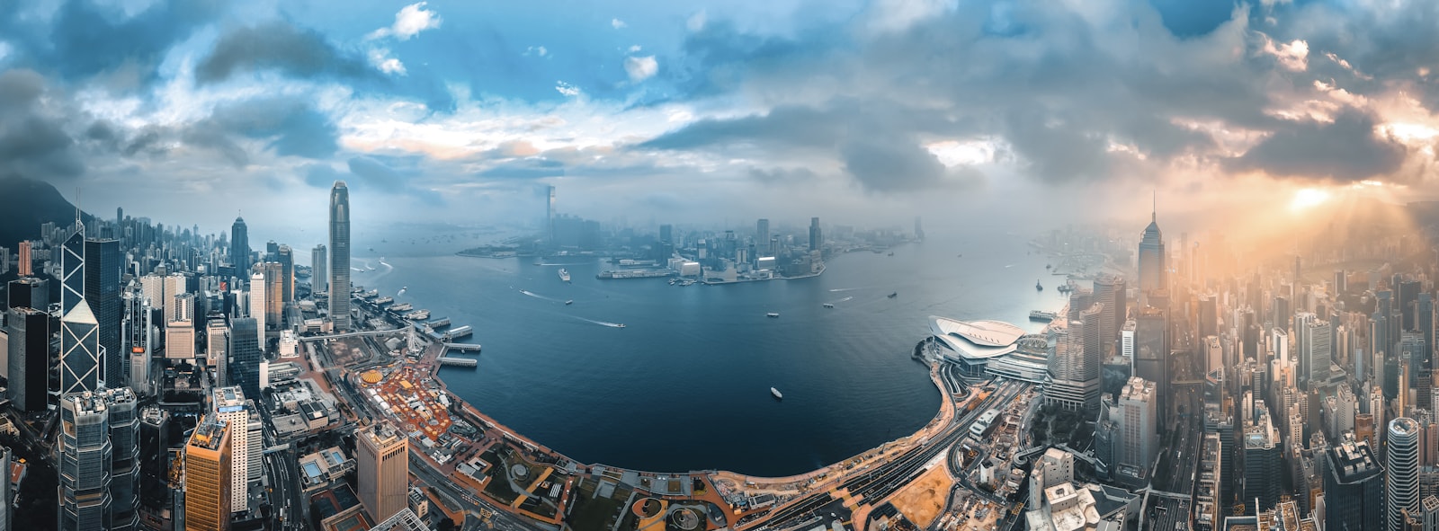 An aerial view of the Hong Kong Island skyline and Victoria Harbour at low sun