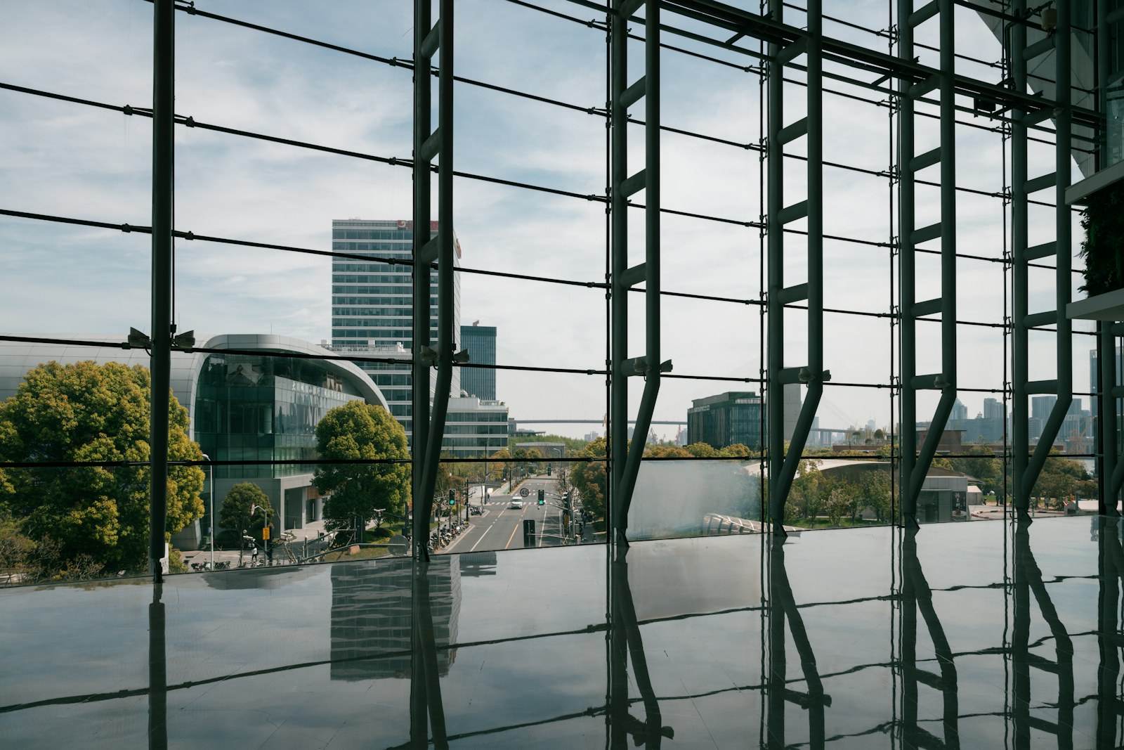 a view of a city through a glass window