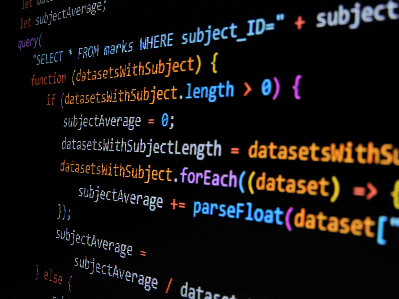 JavaScript code displayed on a dark screen with colorful syntax highlighting