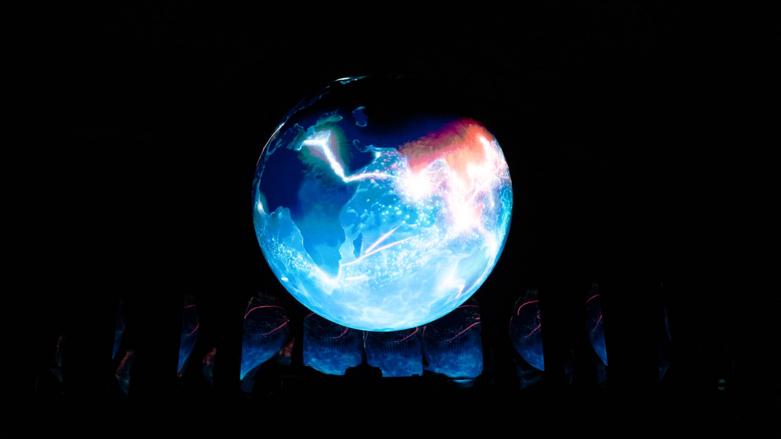 Energetic blue and red glowing orb on a dark background