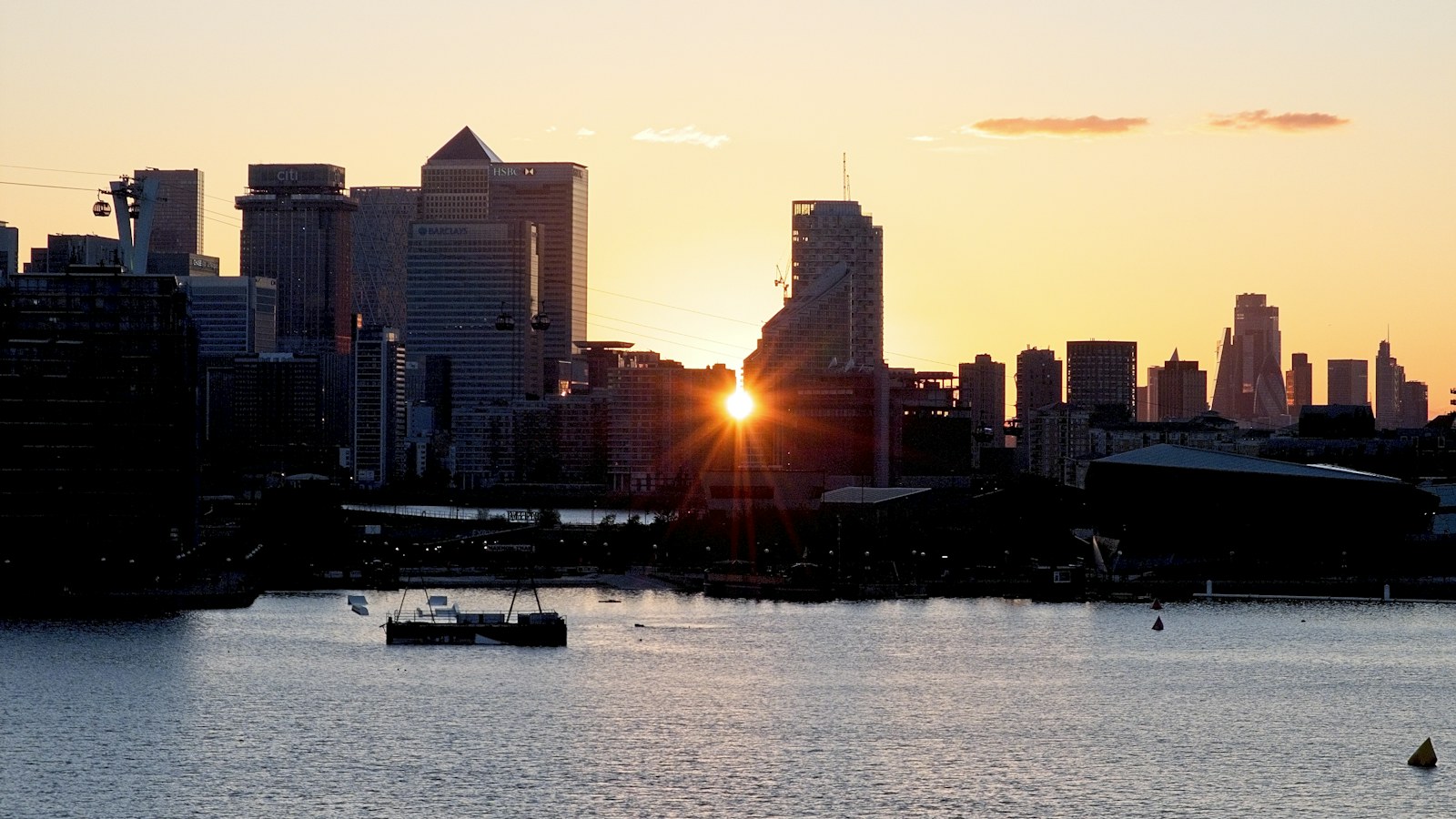 City skyline at sunrise over the water