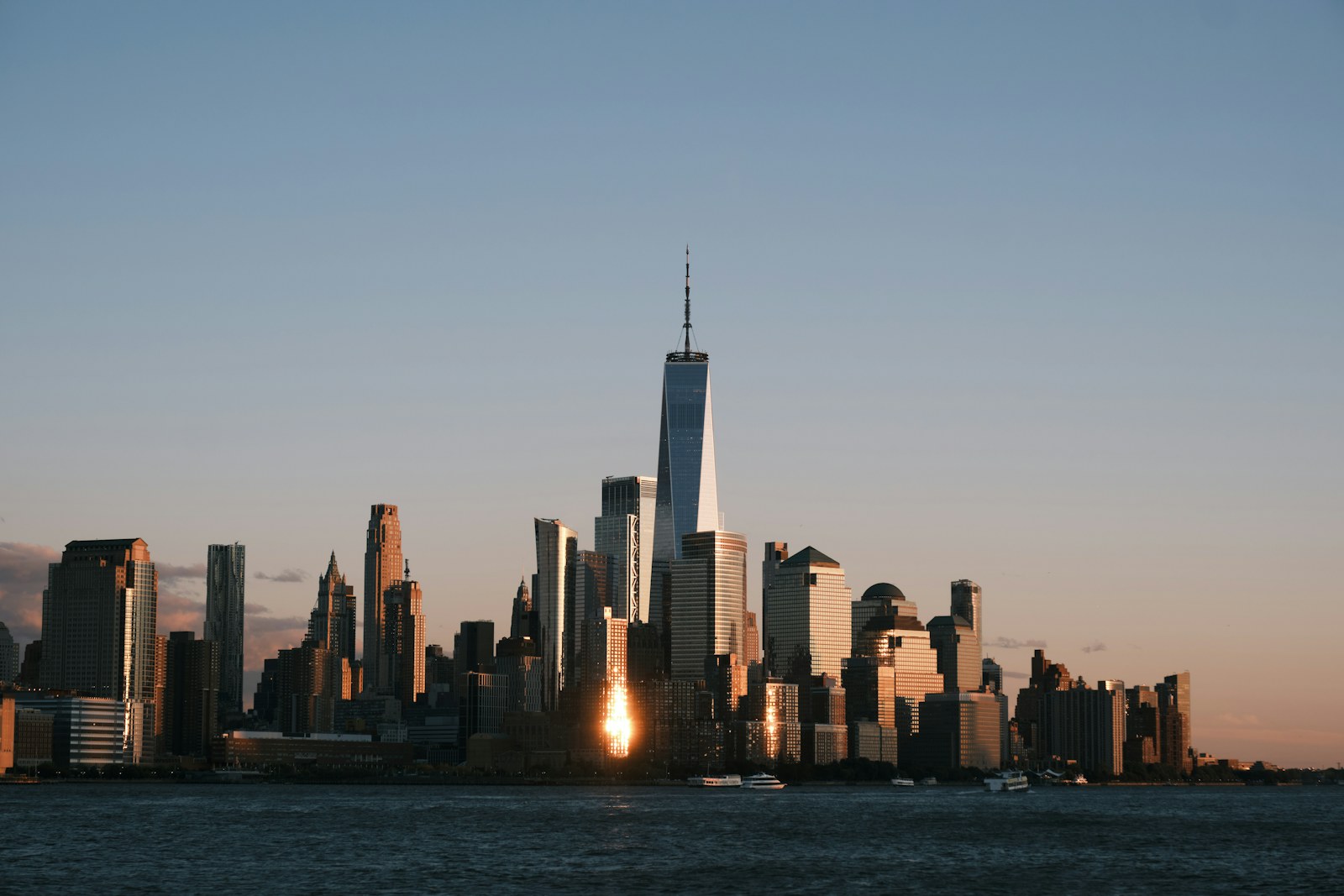 Downtown manhattan skyline at sunset from across the water