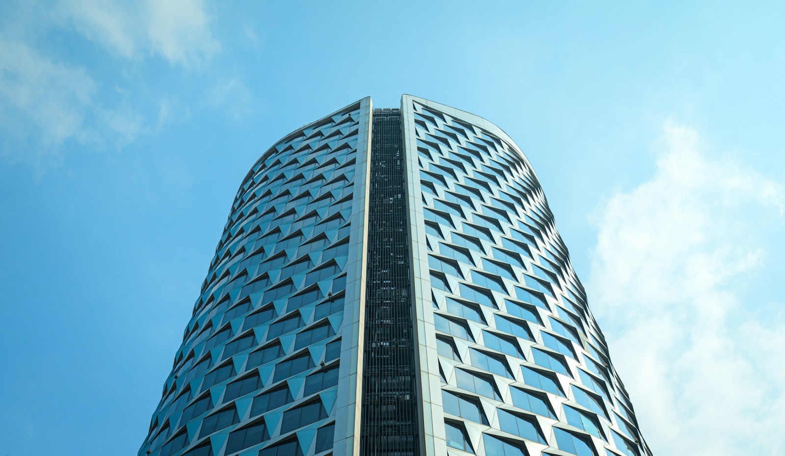 A very tall building with a sky background