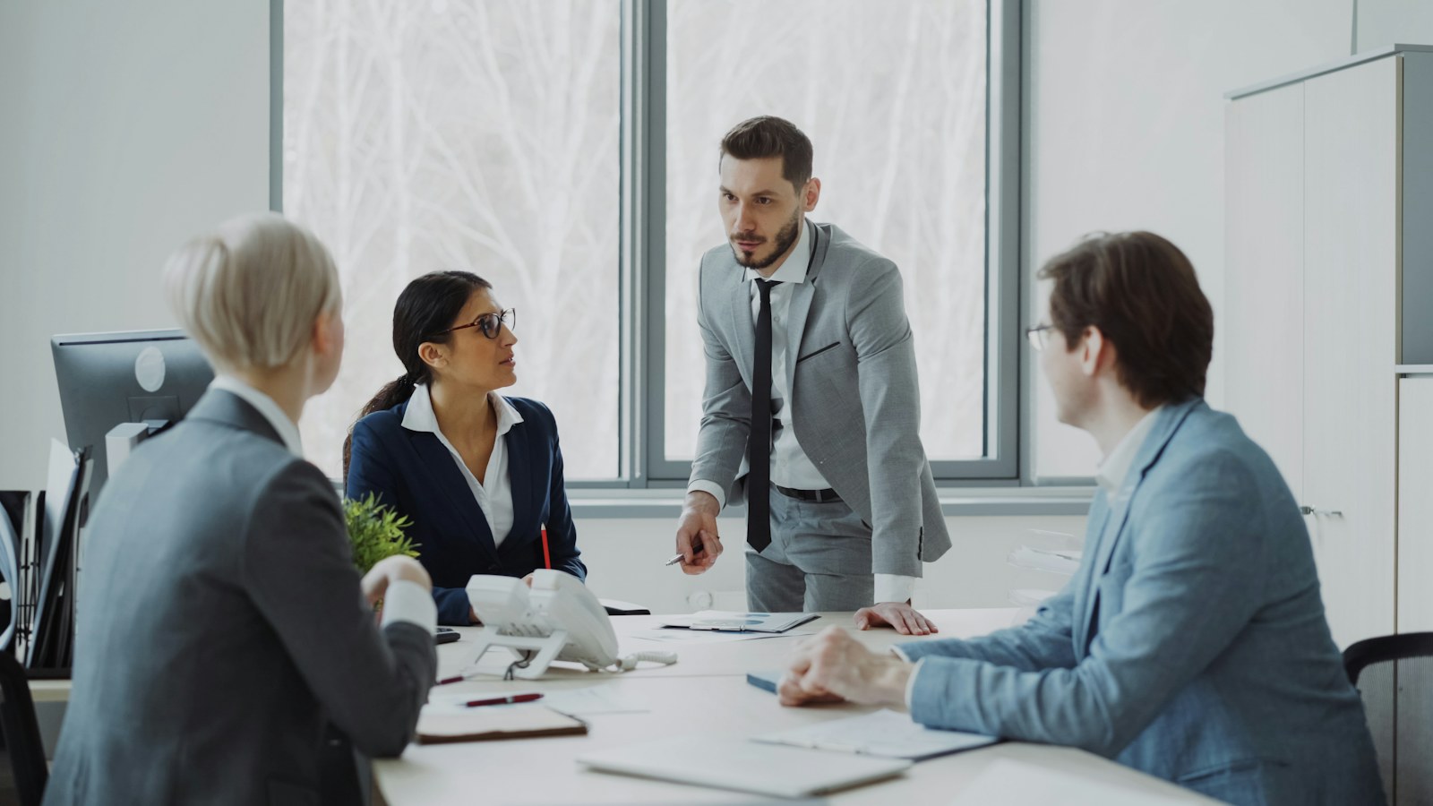 Business professionals in a meeting around a table