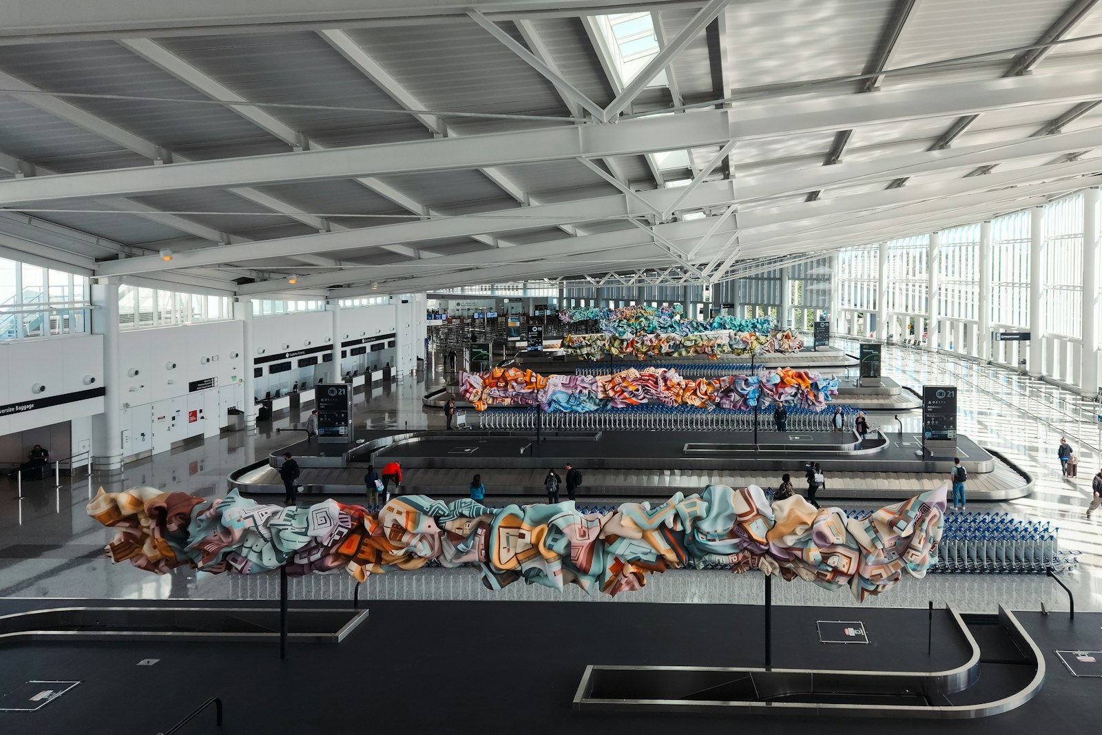 A baggage claim area at an airport with a conveyor belt