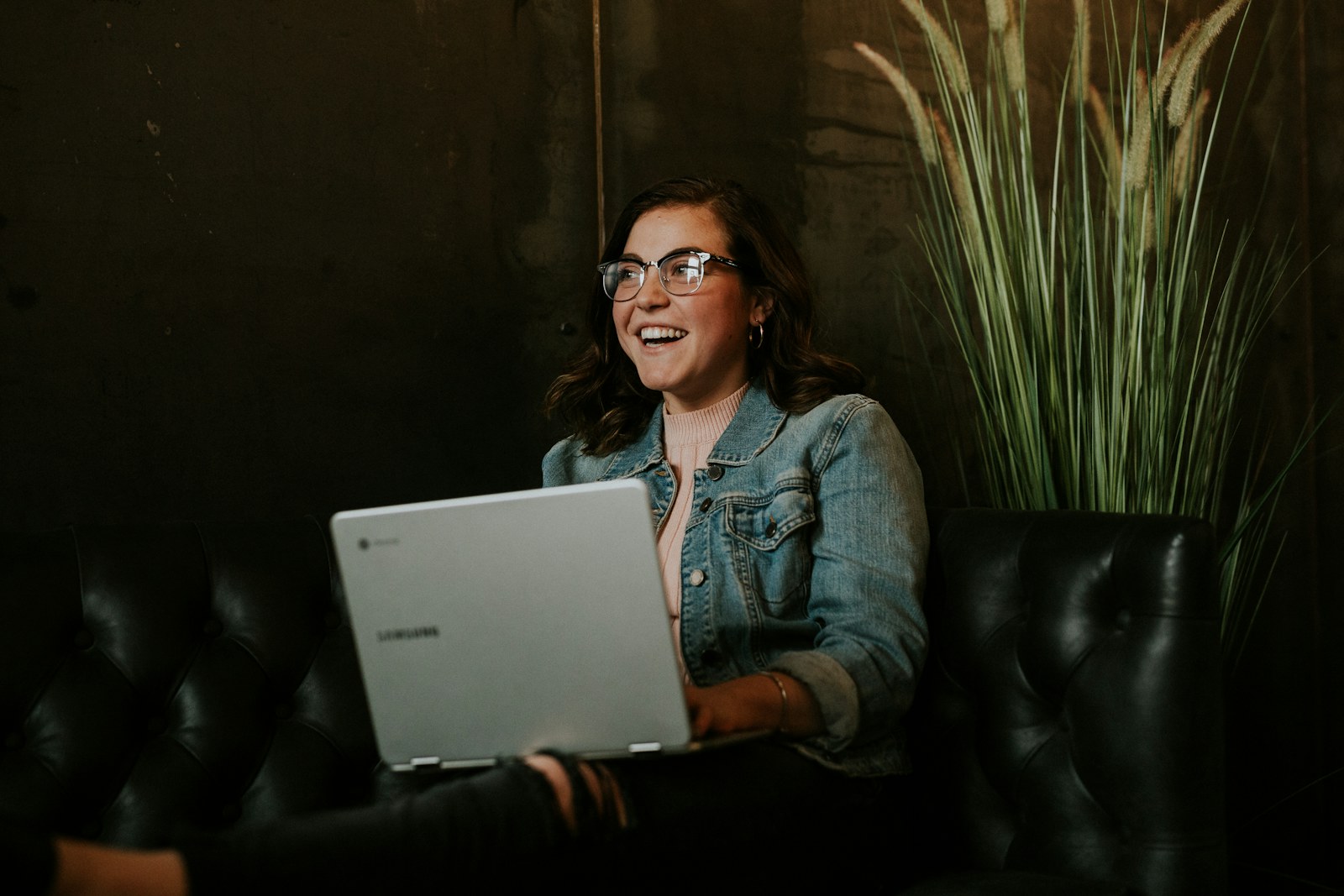 silver laptop on woman's lap