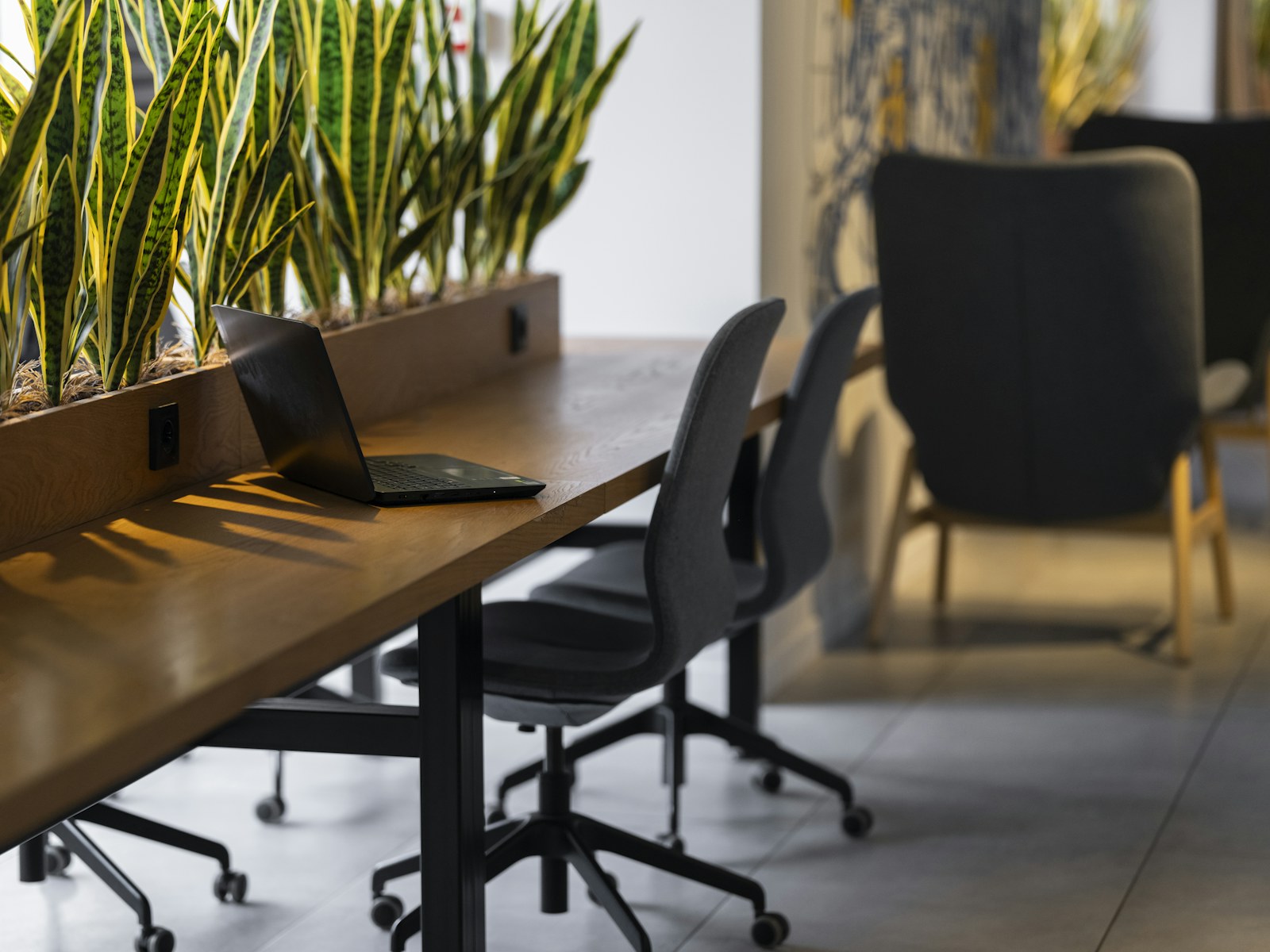 a long table with a laptop on top of it
