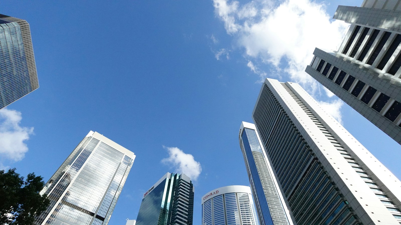 Modern skyscrapers reaching towards a clear blue sky