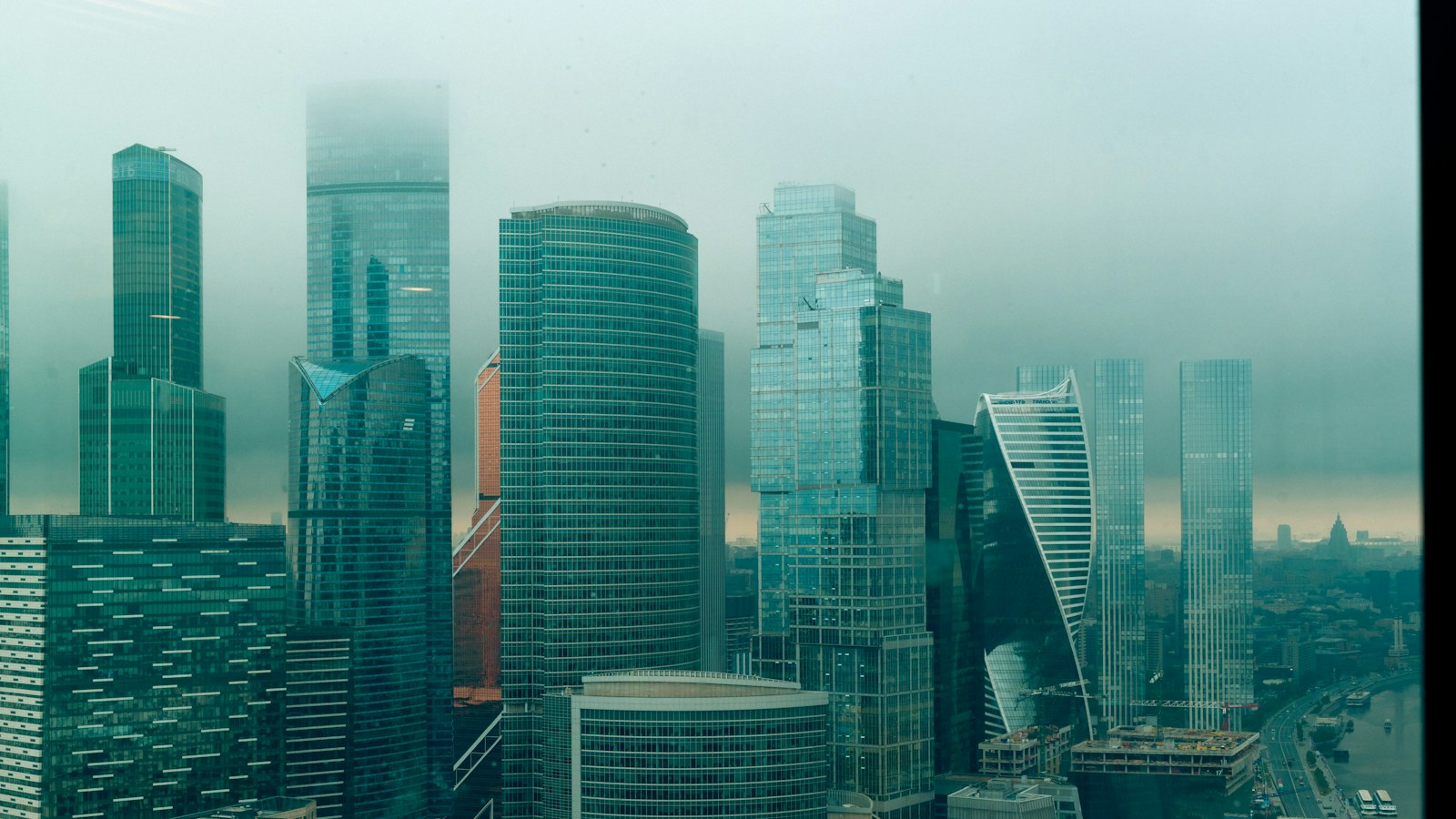 A foggy cityscape with modern skyscrapers