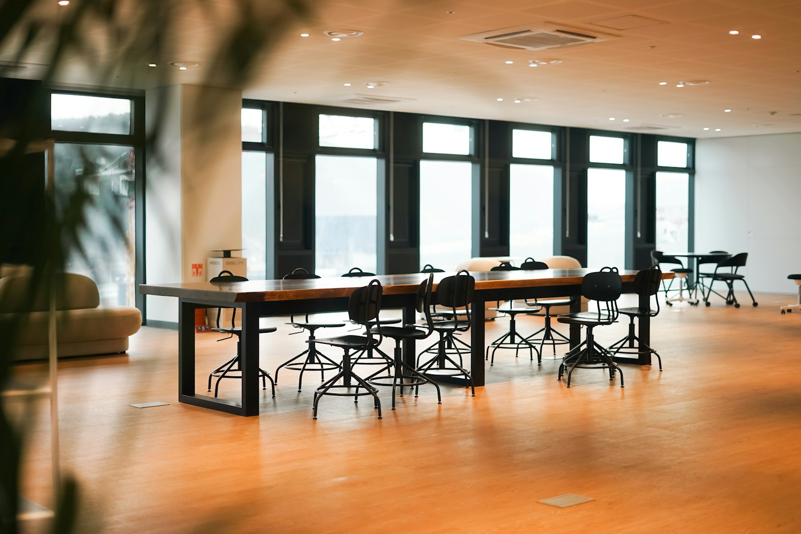 a large room with a long table and chairs
