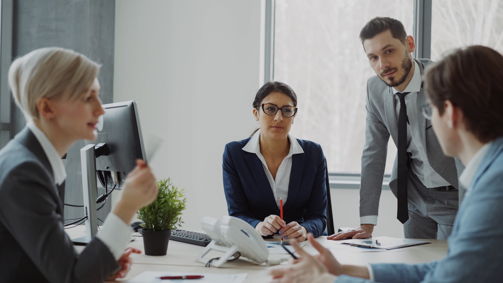 Business professionals collaborating in a modern office meeting