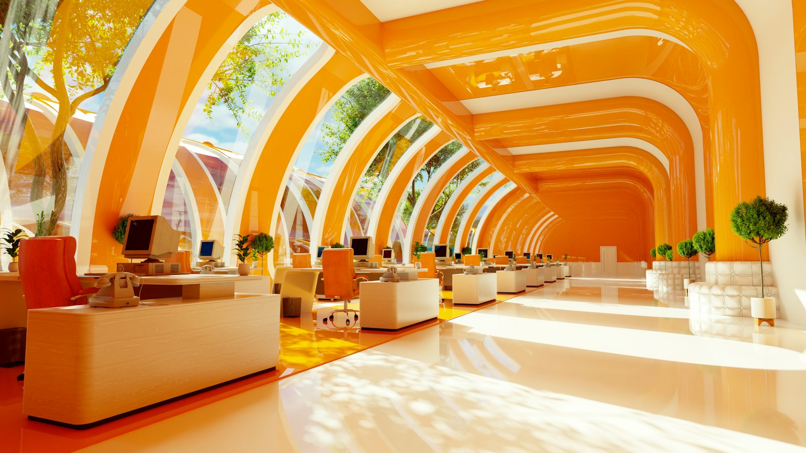 A bright office with orange curved arches and rows of desks with computers