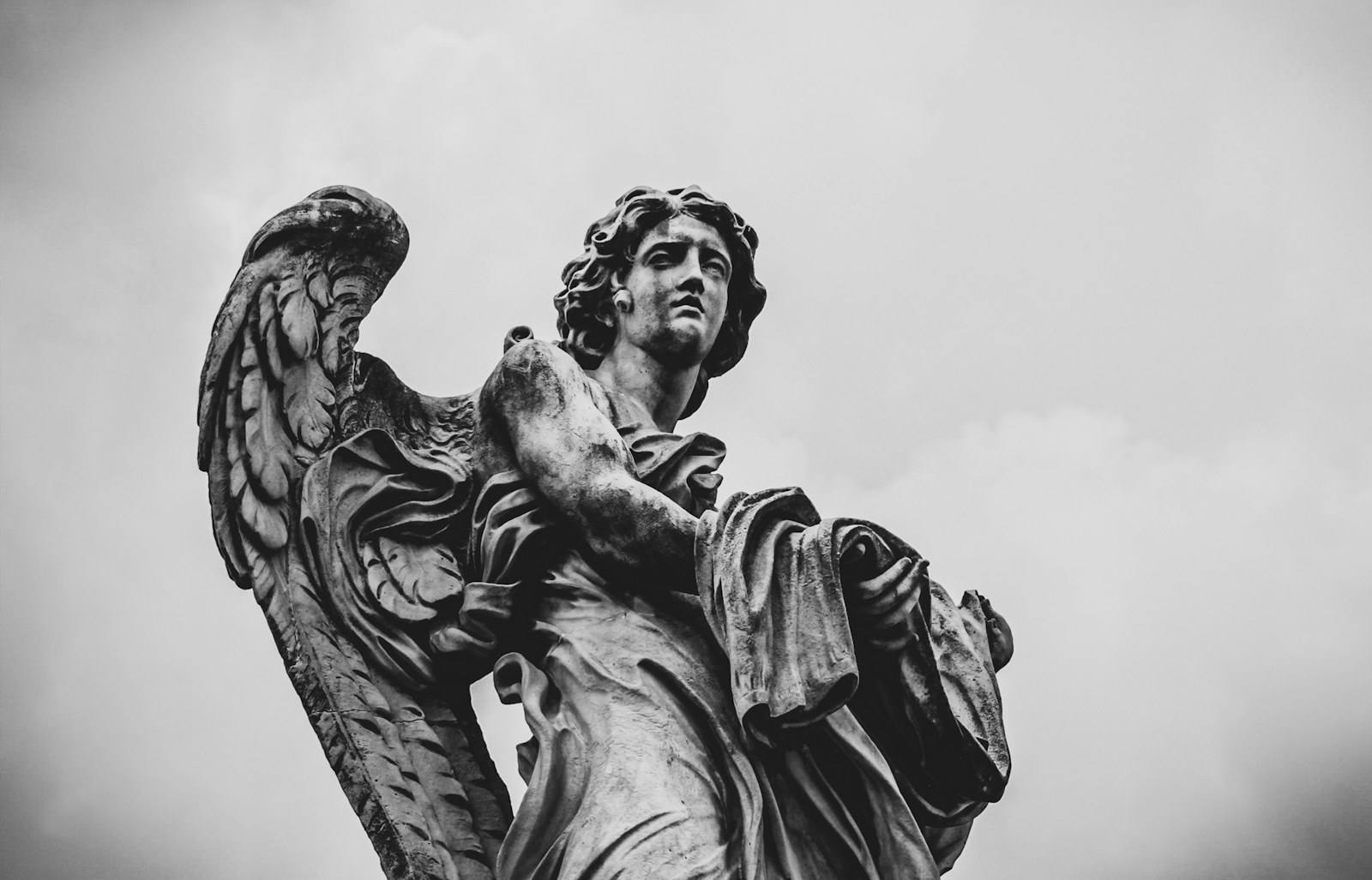 grayscale photo of woman statue