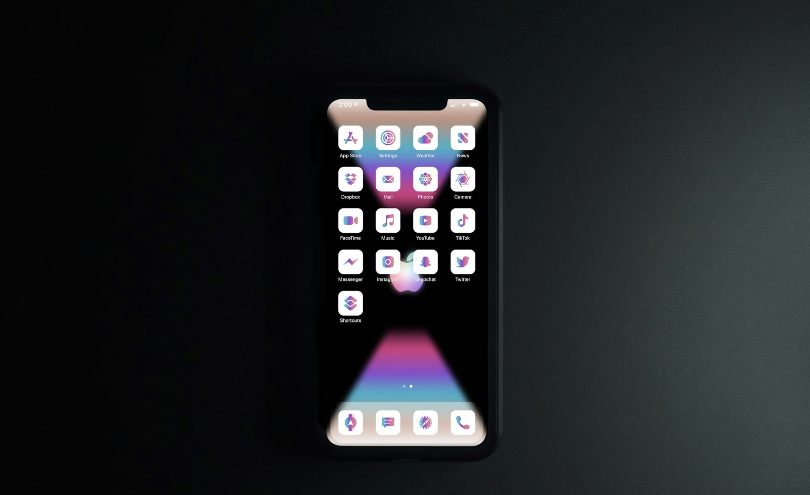 black iphone 4 turned on displaying icons