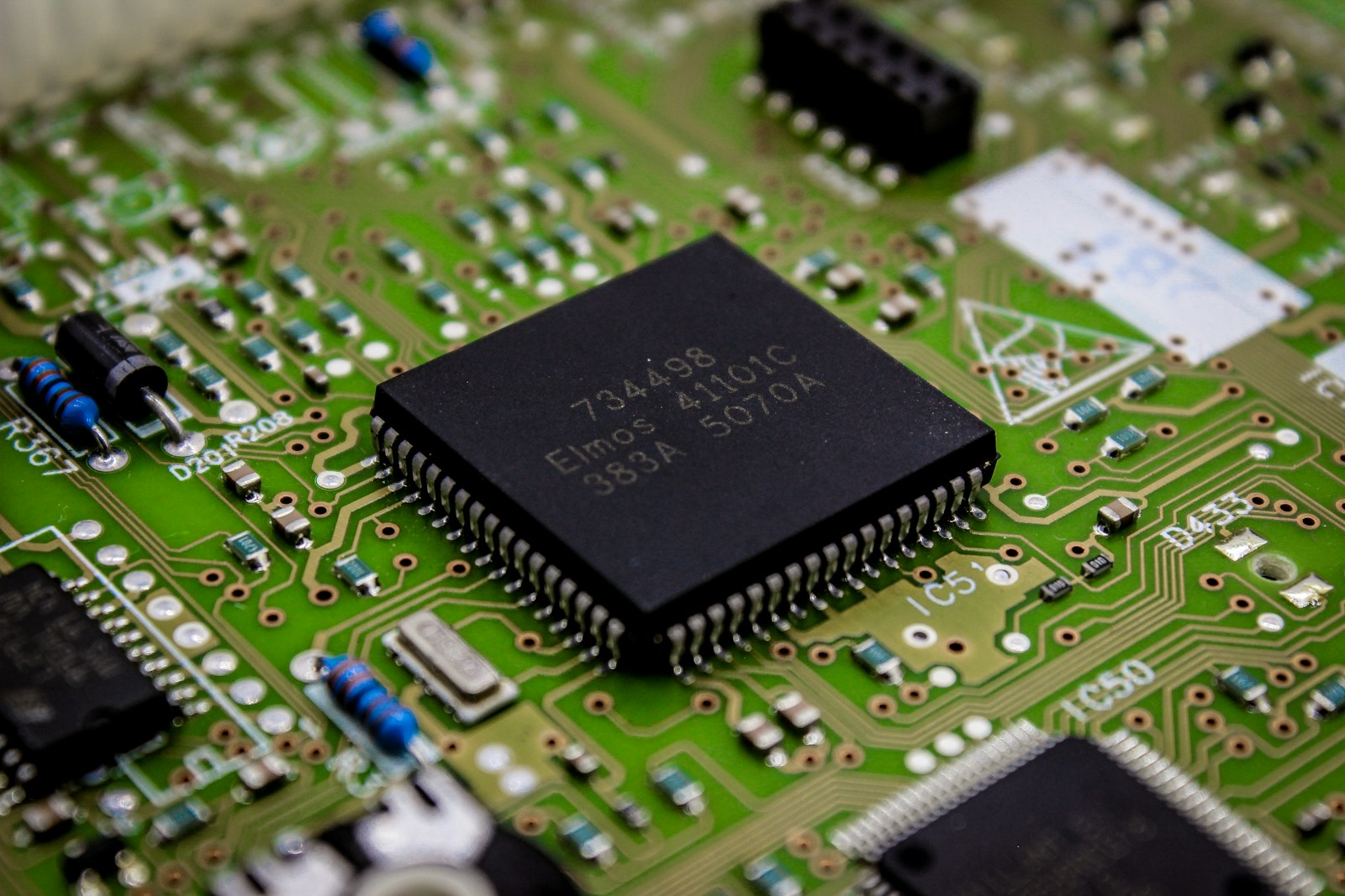 a close up of a computer chip on a printed circuit board