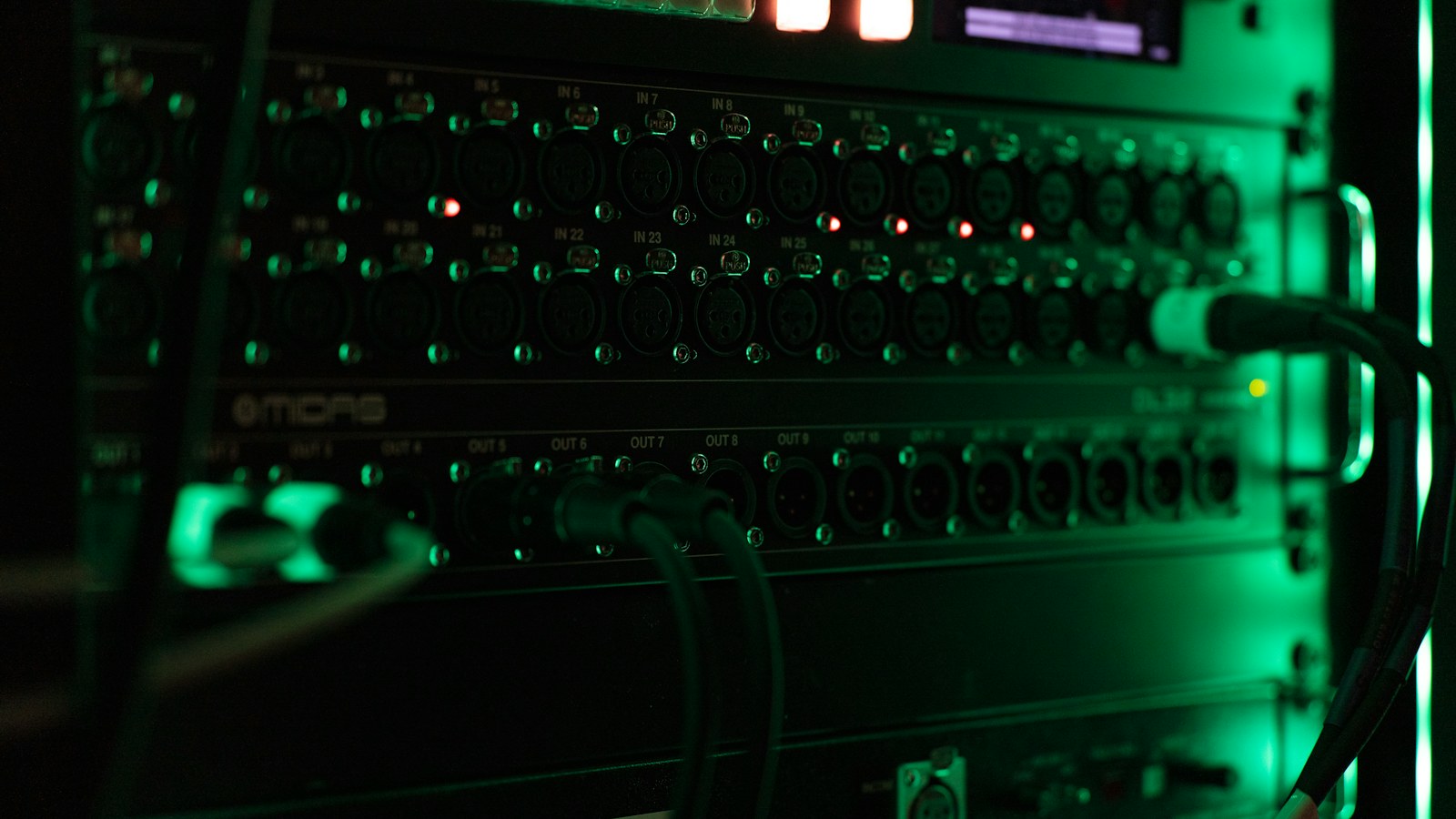 a close up of a computer with green lights